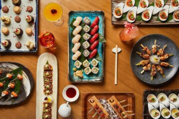 A beautifully arranged bento box with sushi, grilled fish, and vegetables, showcasing the refined dining experience at Nobu Shoreditch.