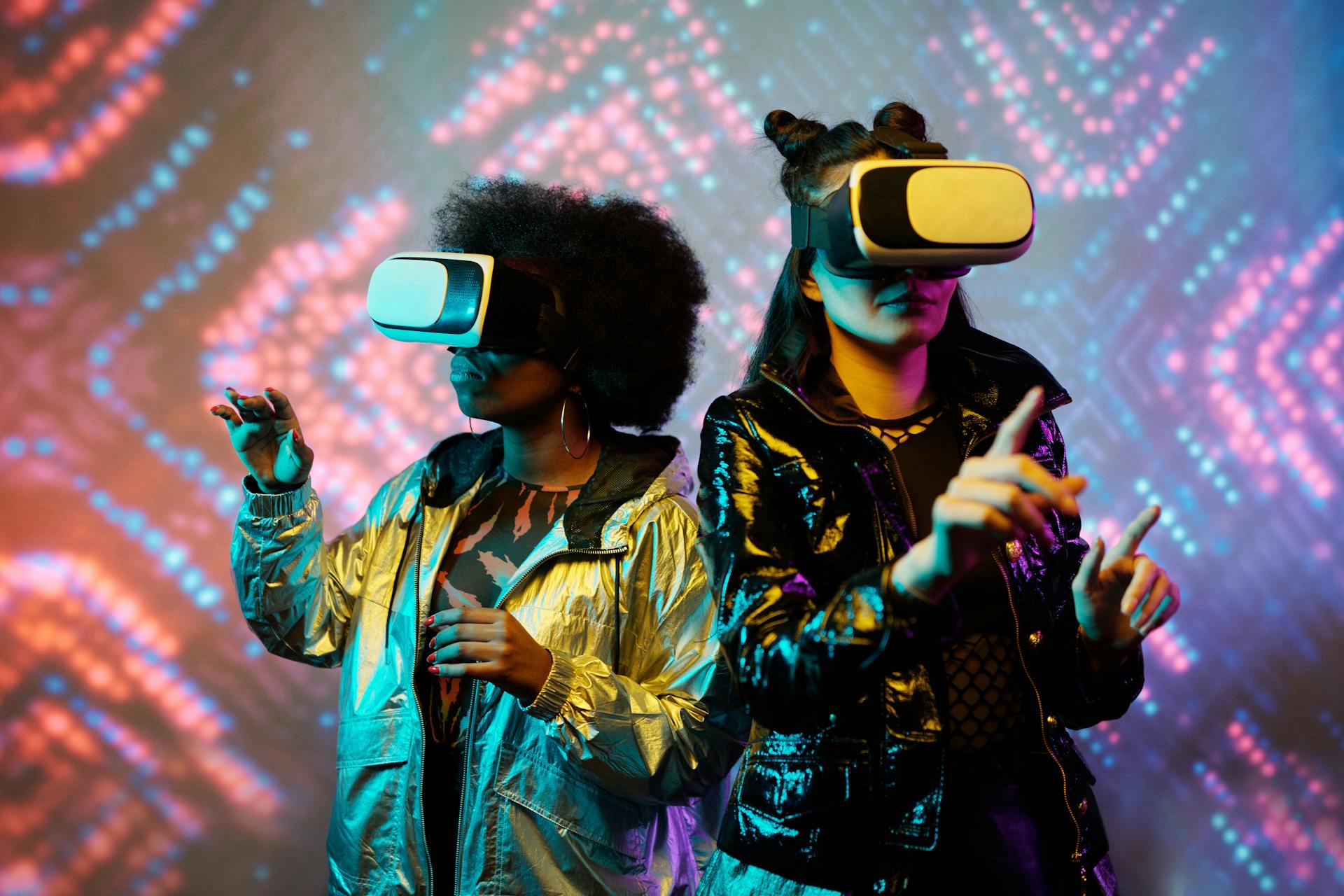 Two individuals wearing VR headsets explore immersive visuals, symbolizing the future of digital art and interactive creativity.