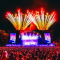 Spectacular fireworks light up the night sky at Gunnersbury Park London, as a massive crowd enjoys an electrifying live concert.