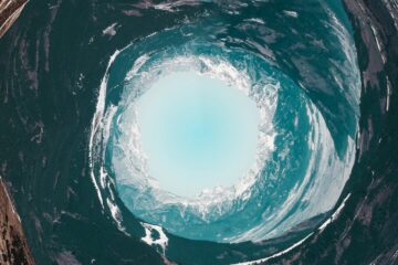 Surreal digital artwork depicting a water-filled vortex—explore the artistic vision behind Planet Aqua in this Made in Shoreditch feature.