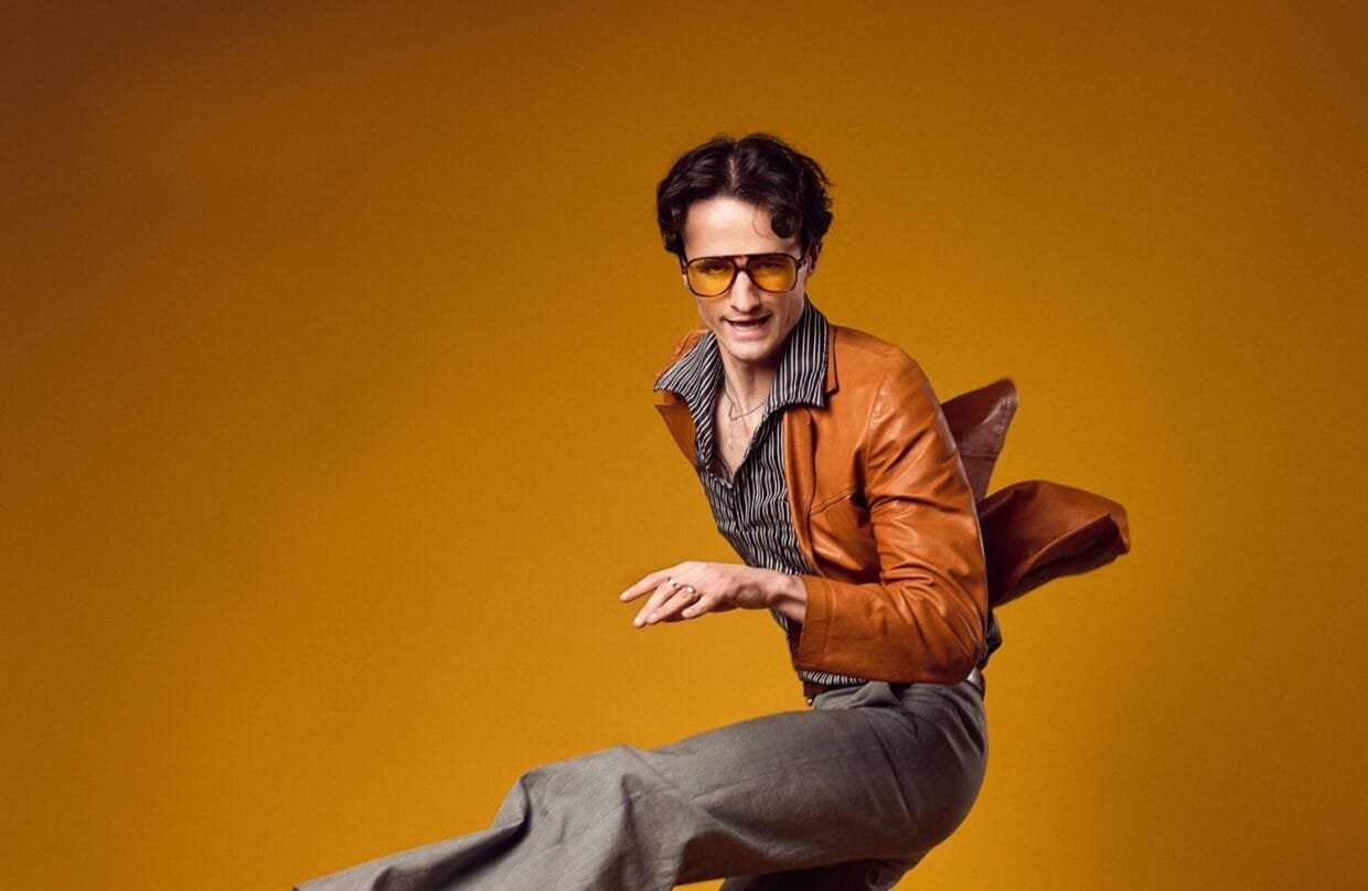 Jazz Emu: The Viral Satirist Bringing Ego Death and Masculinity’s Glorious Meltdown 6 Jazz Emu performs in full disco persona on stage with synth backdrop