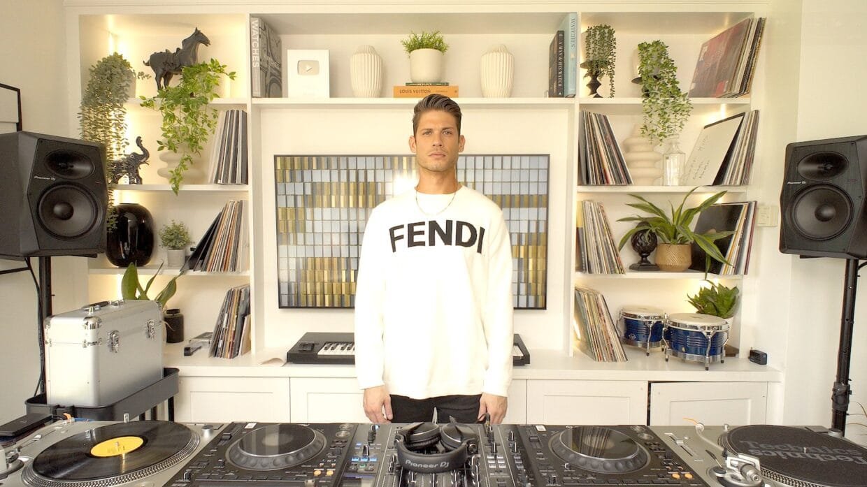 Alejandro Zamora in his studio surrounded by records and turntables