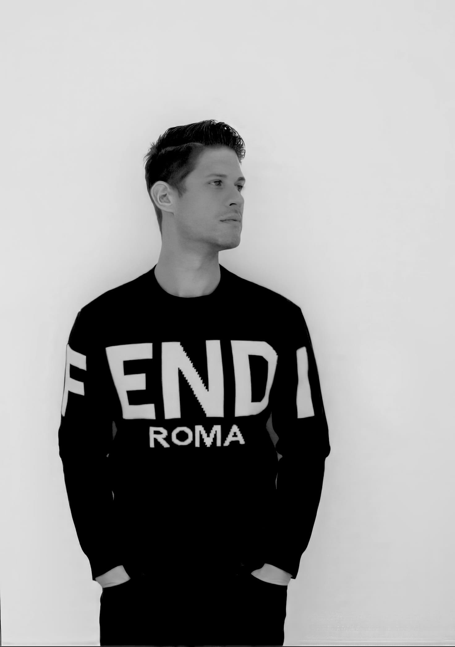 Alejandro Zamora standing against the wall