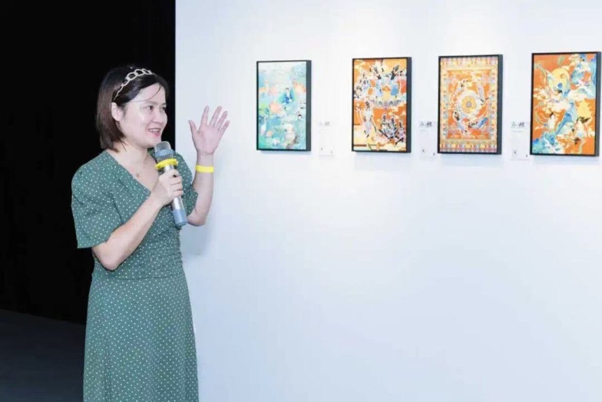 Exploring Dunhuang Traditions and Therapeutic Art with Dongling Huang 6 Dongling Huang presenting her therapeutic art at an international exhibition