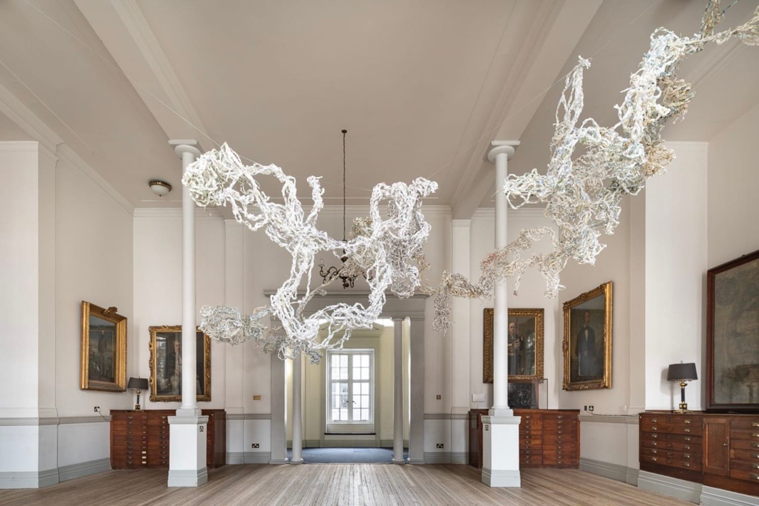 Sonia E. Barrett on Colonial Histories, Healing, and New Futures 7 Dreading the Map created as a map lective The Royal Geographical Society London 2021 Antique dated and contemprary maps paper string metal 400 x 500 x 500 cm