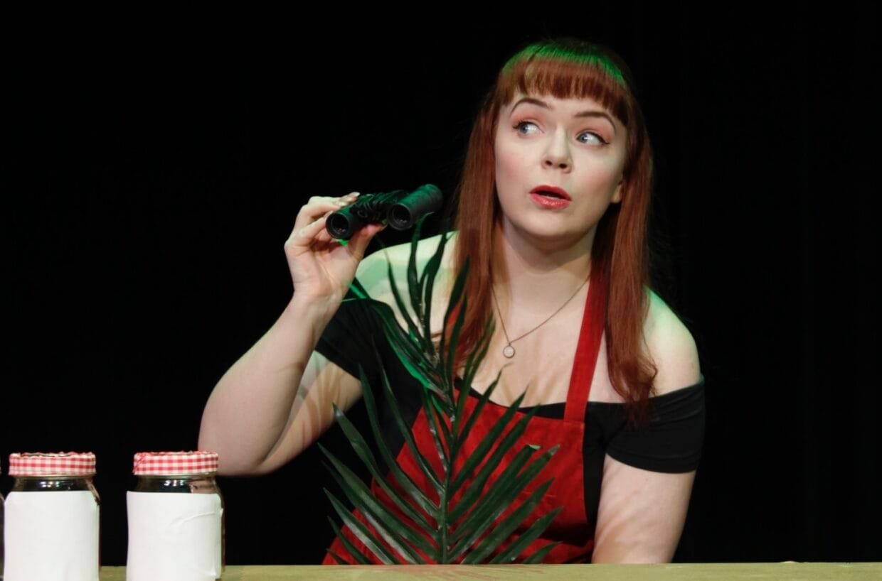 Rebecca Perry Talks Nostalgia, Millennials and Espresso-Fuelled Comedy 6 Rebecca Perry on stage performing Confessions of a Redheaded Coffeeshop Girl