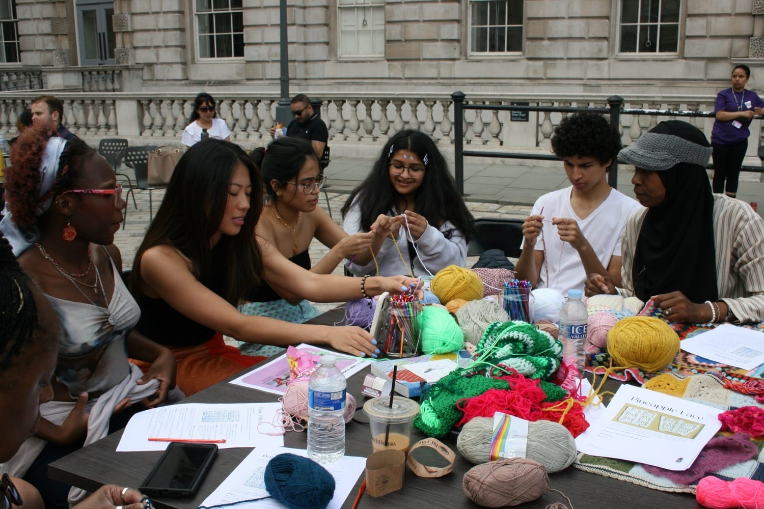 Coléchi’s community knitting club in action with Piarvé Wetshi