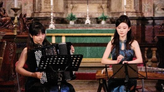 Mengdie Ji performing Awakening with guzheng and accordion at London Chinese Music Festival