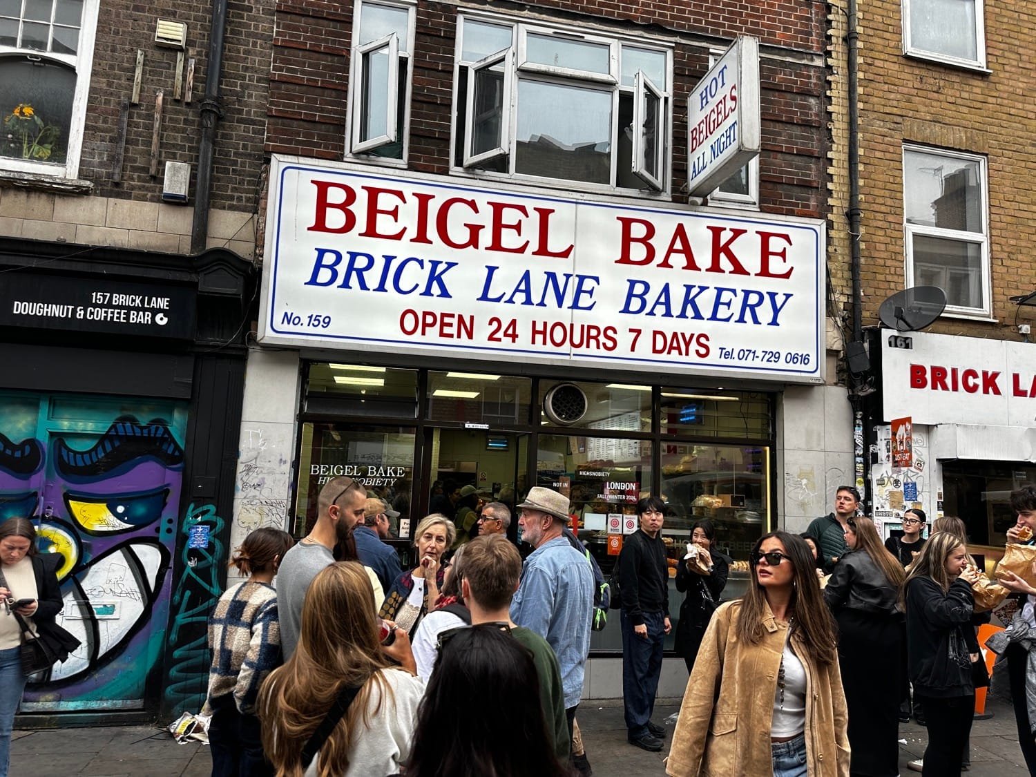 Best Restaurants in Shoreditch: Where to Eat, Drink & Discover Local Flavours 7 people queueing at Beigel Bake one of the most famous restaurants in Shoreditch
