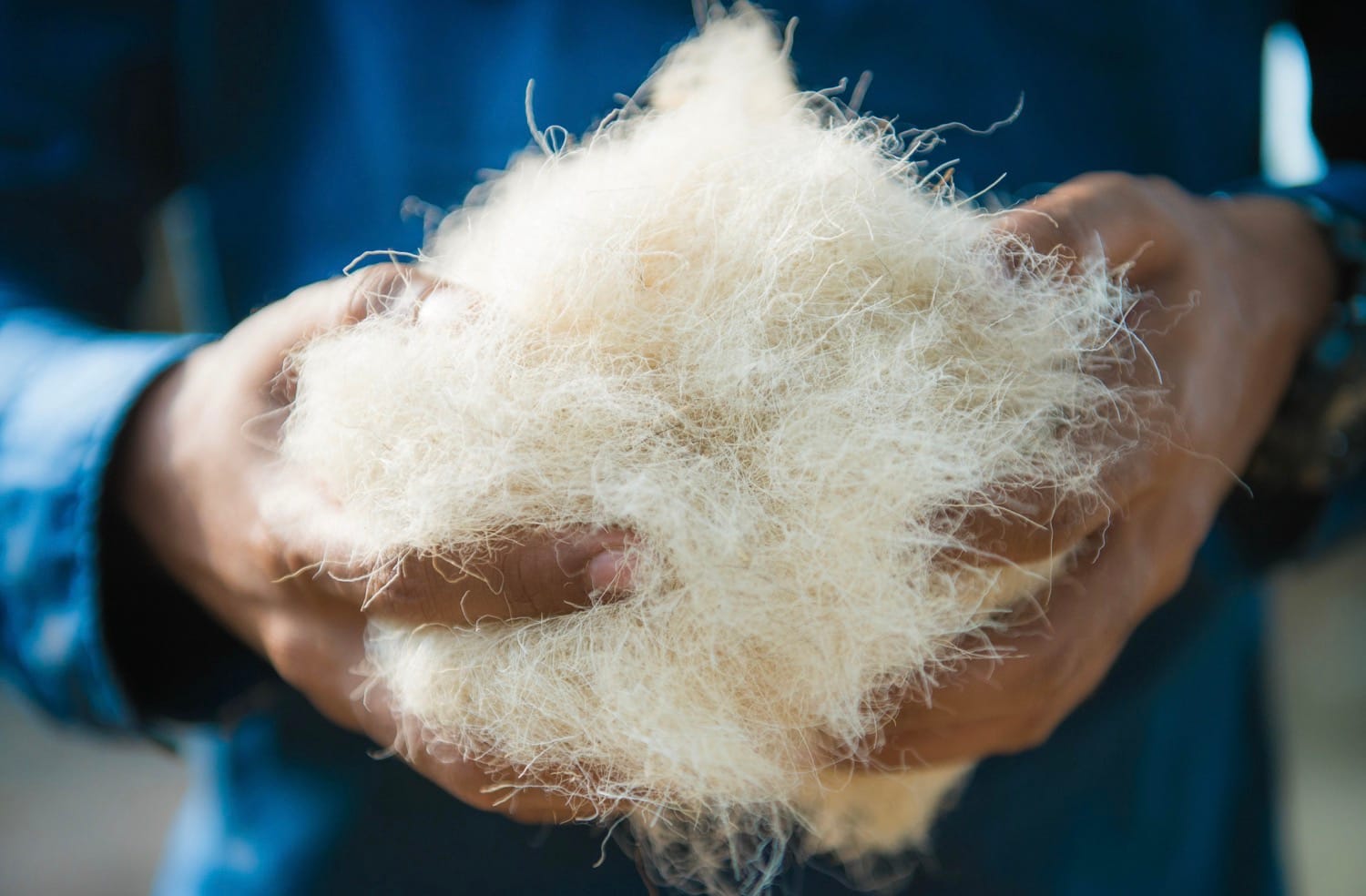 man holding sustainable fashion materials