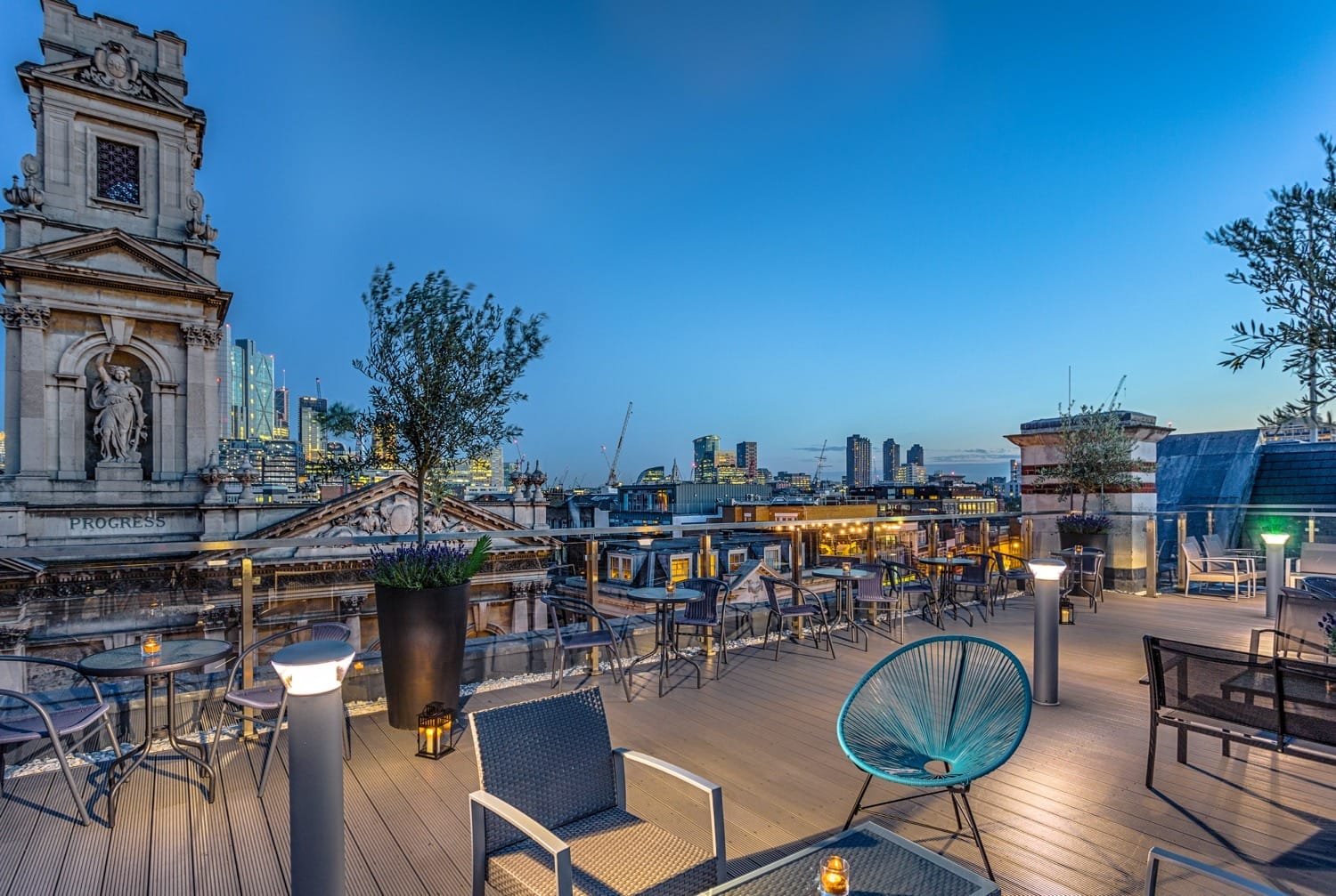 Courthouse Hotel Shoreditch rooftop bar with city views and guests