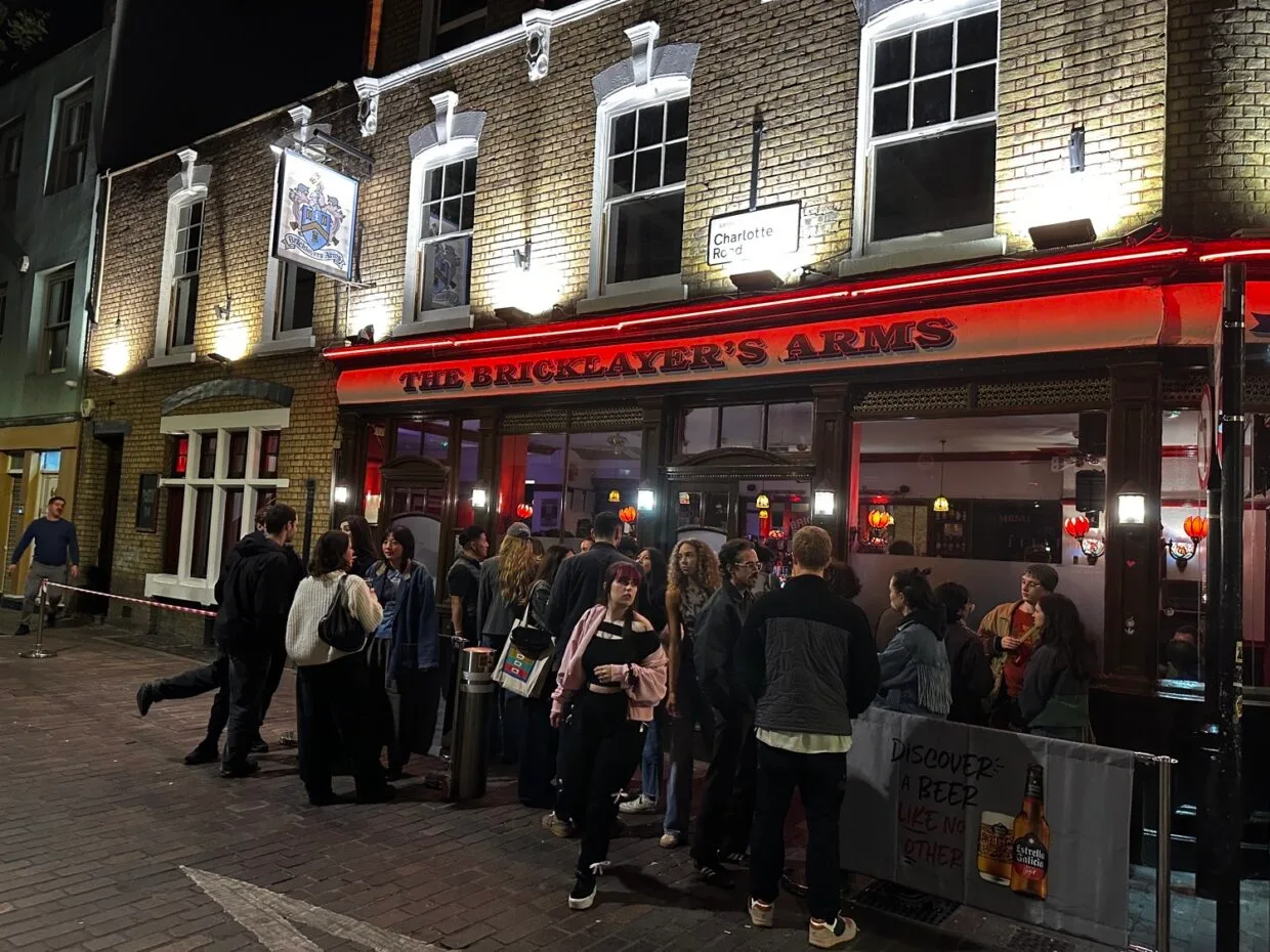 Best Places to Go Out in Shoreditch – The Ultimate Nightlife Guide 6 People standing at Bricklayers arms pub at one of the places to go out in Shoreditch
