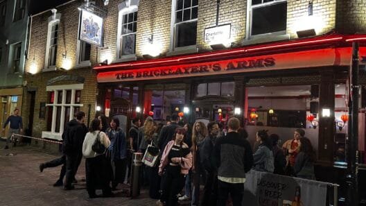 People standing at Bricklayers arms pub at one of the places to go out in Shoreditch