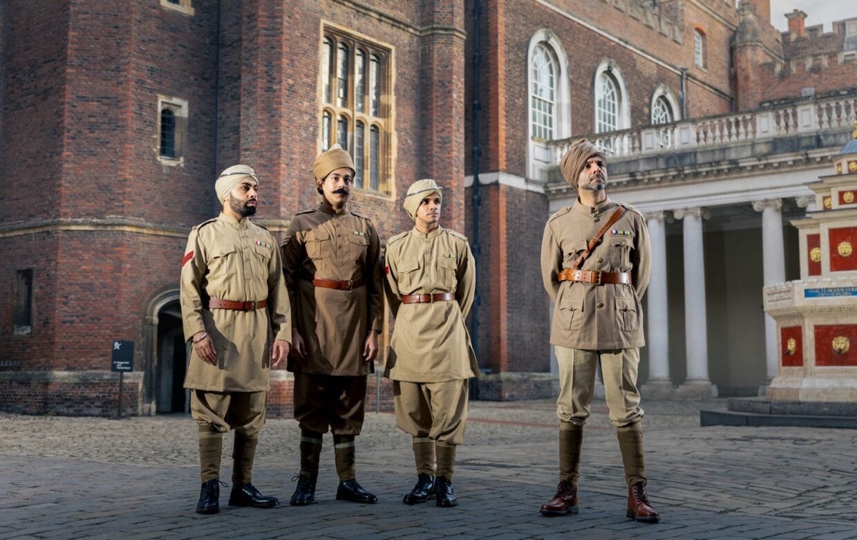 Cast performing The Indian Army at the Palace with marigold pins