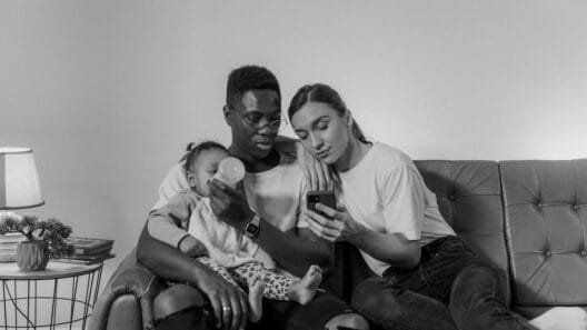 parents feeding baby with baby bottles