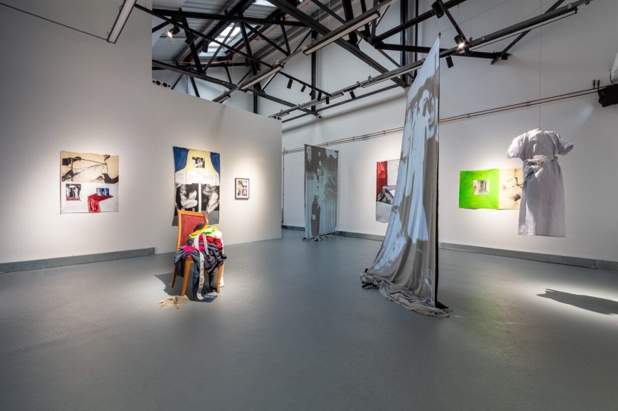 Projected footage of dancing figures in the immersive exhibition.