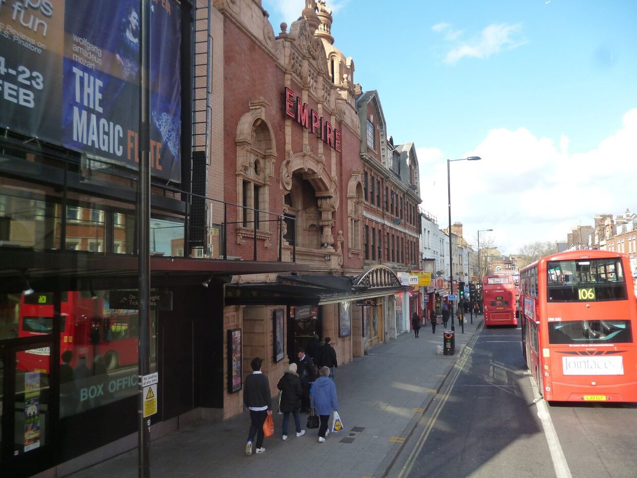 The Hackney Empire theatre on Mare Street with a red bus passing