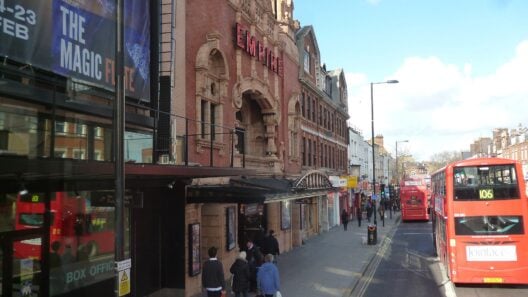 The Hackney Empire theatre on Mare Street with a red bus passing