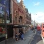 The Hackney Empire theatre on Mare Street with a red bus passing