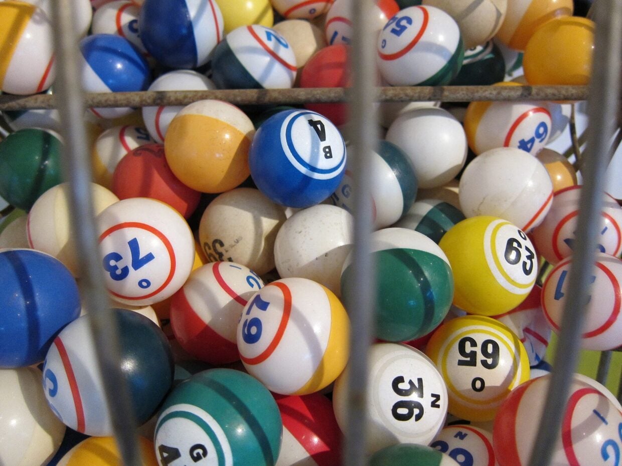 Bingo balls inside a wire drum