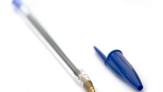 Blue Bic Cristal ballpoint pen with its cap removed