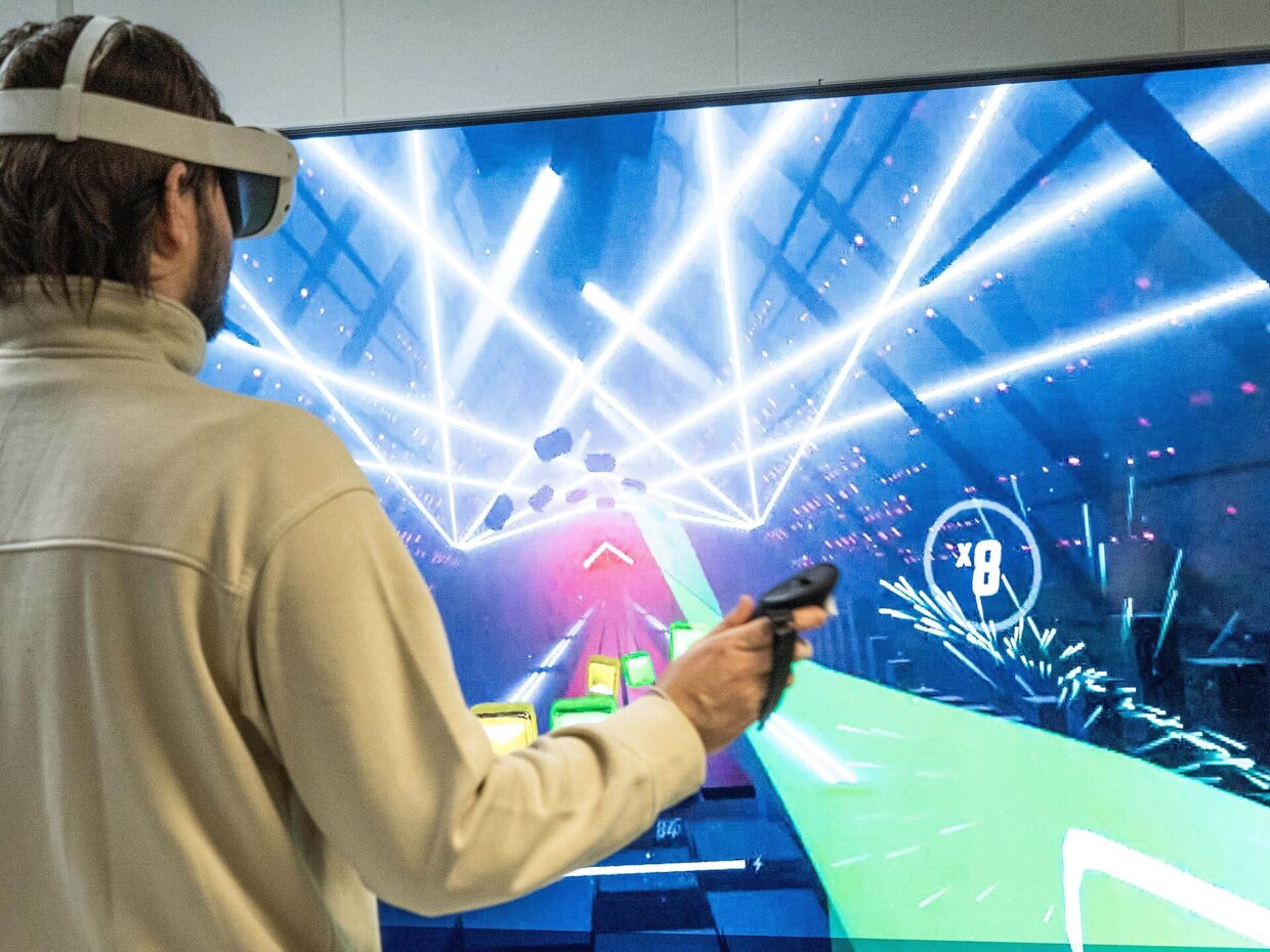 Person playing a game in a virtual reality headset