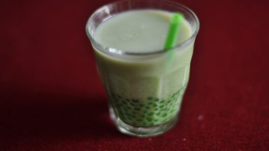 A cup of matcha bubble tea with tapioca pearls