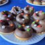 A tray of chocolate doughnuts
