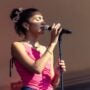 Olivia Dean performing on stage