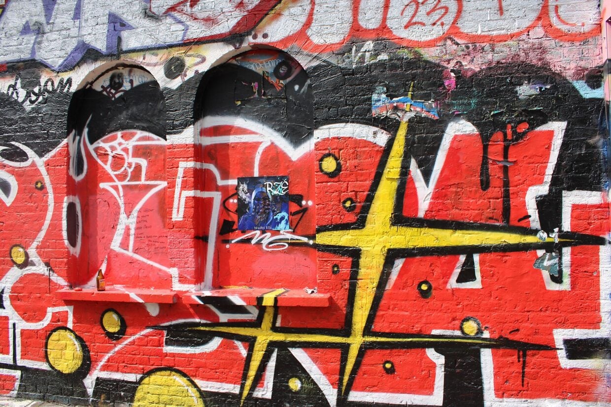 View of street art on the front of Shoreditch tube station on Pedley Street - geograph.org.uk - 7828536